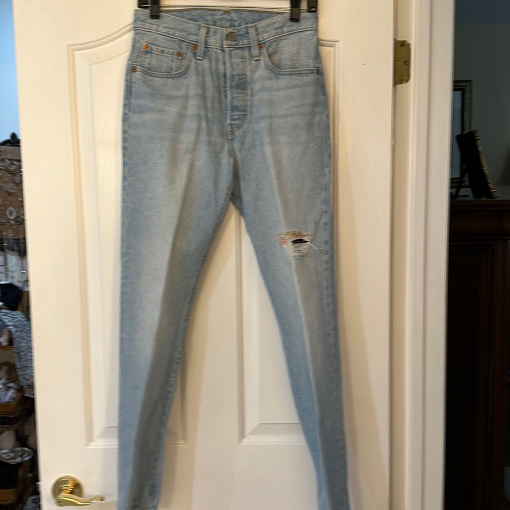 Levi’s 501 faded denim jeans